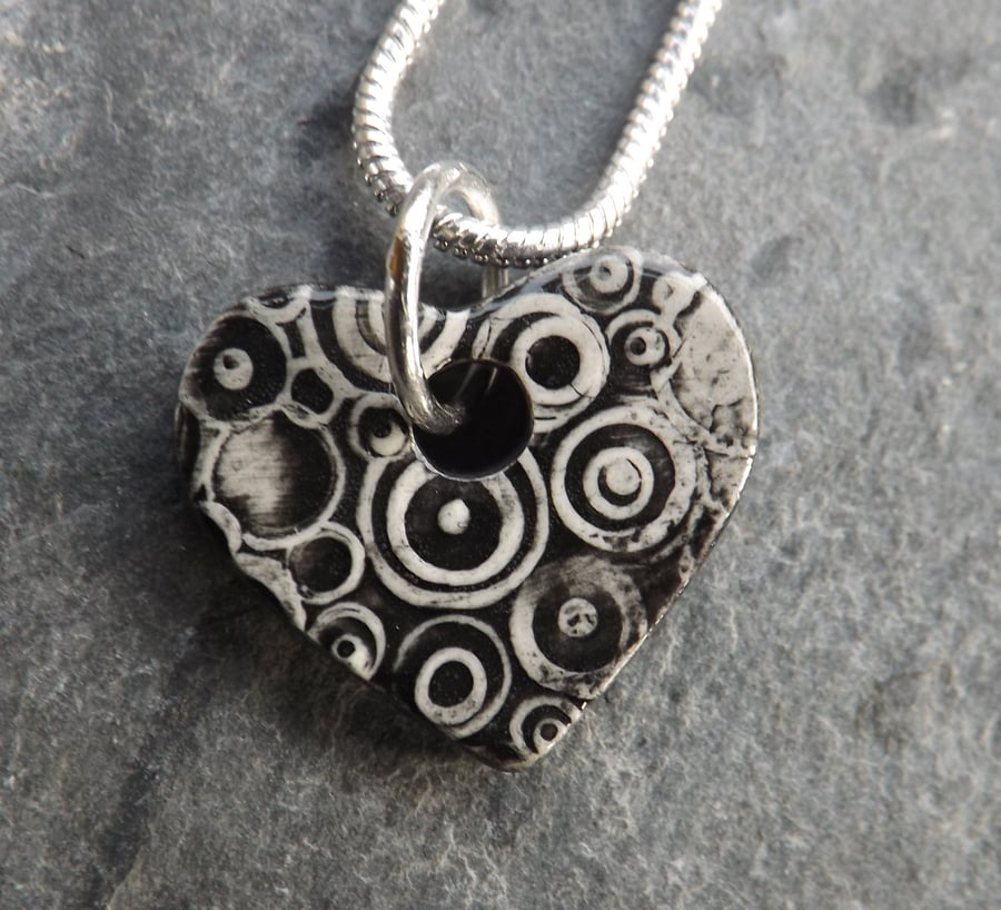 Heart shaped ceramic pendant in black white and grey 