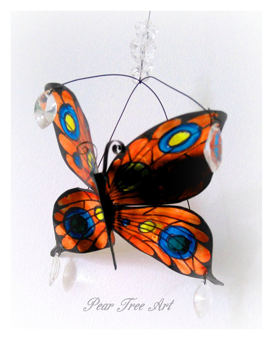 Orange Metal Butterfly hanging decoration. Made from a coffee tin.