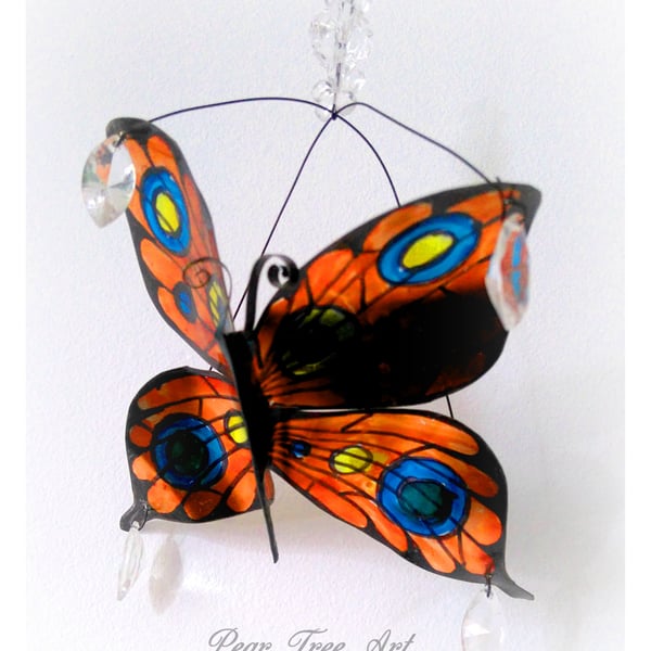 Orange Metal Butterfly hanging decoration. Made from a coffee tin.