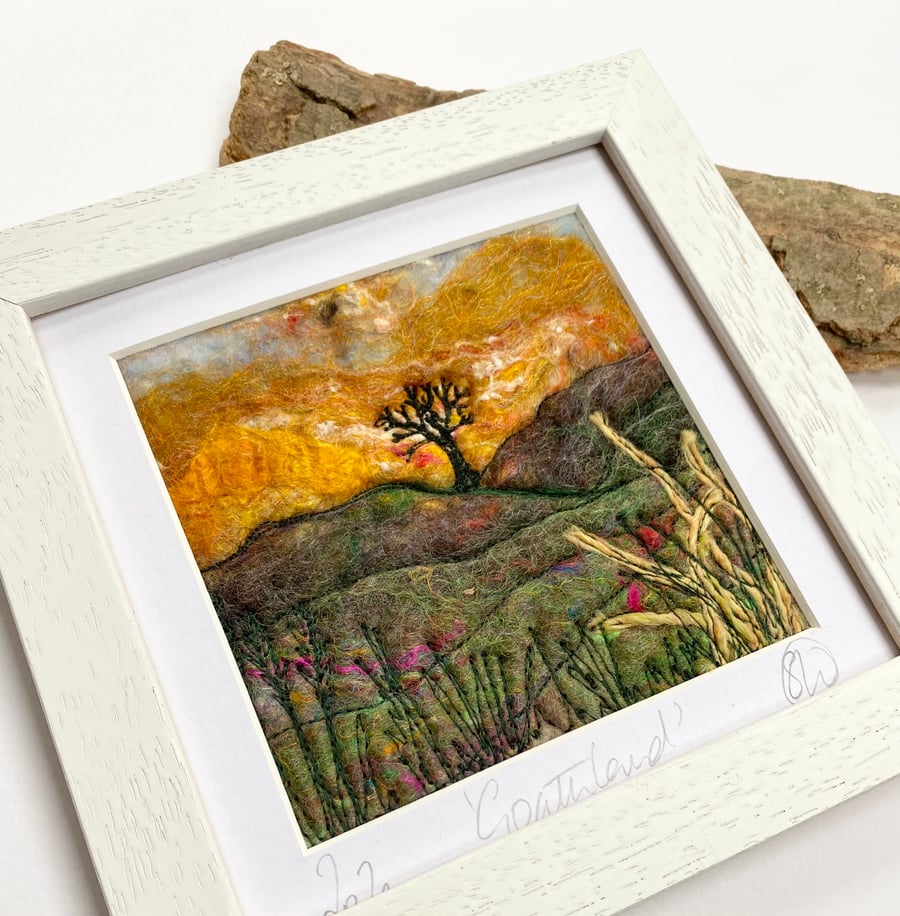 Sunset countryside moorland landscape with tree. 