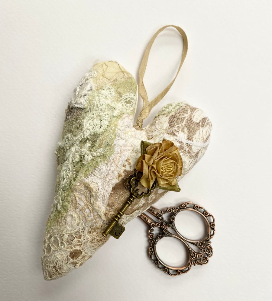 Embroidered up-cycled lace, key and rose love heart decoration.