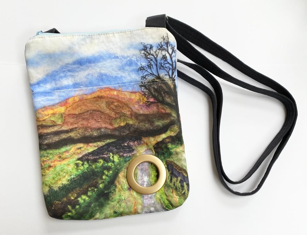 Cross body dog walking bag with adjustable strap. 