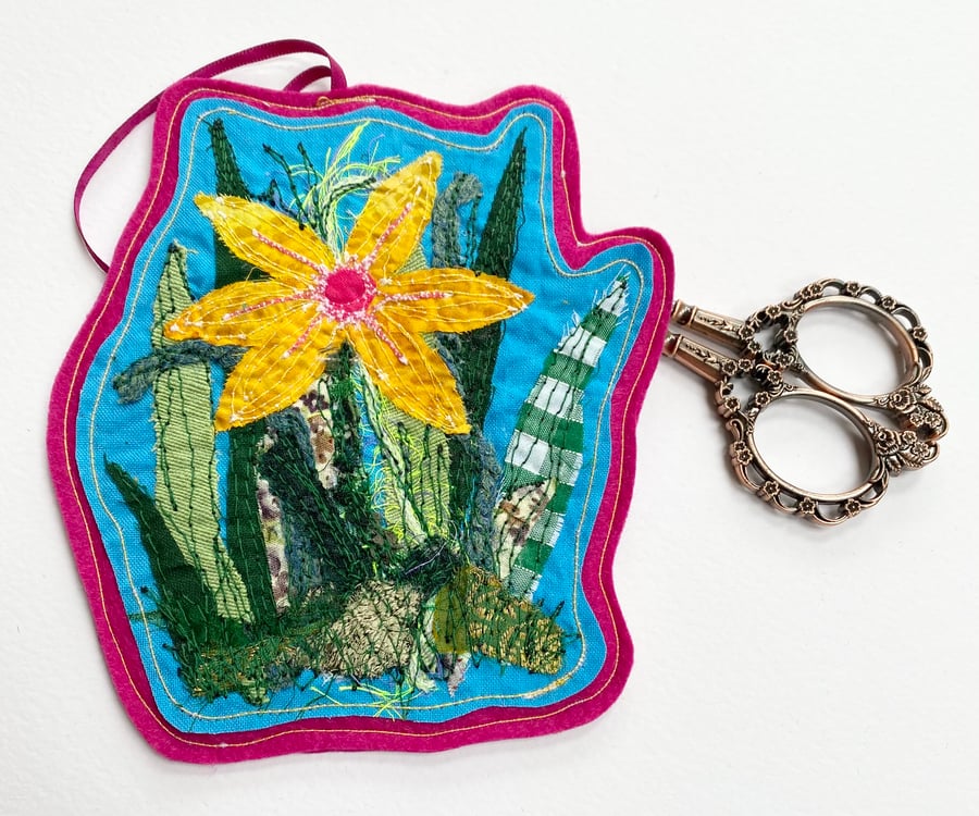 Embroidered up-cycled flower garden home decoration.