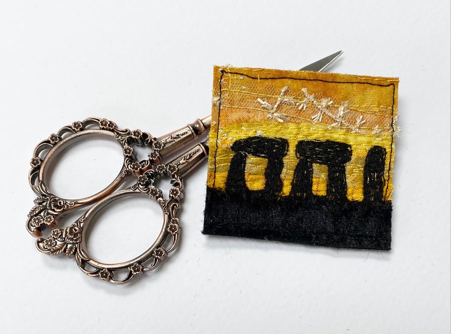 Upcycled embroidered stone henge sunrise brooch pin or badge.