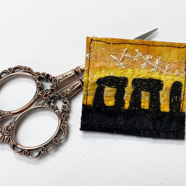 Upcycled embroidered stone henge sunrise brooch pin or badge.