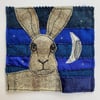 Upcycled hare and moon embroidery. 