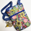 Flower cross body bag with adjustable strap. 