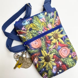 Flower cross body bag with adjustable strap. 