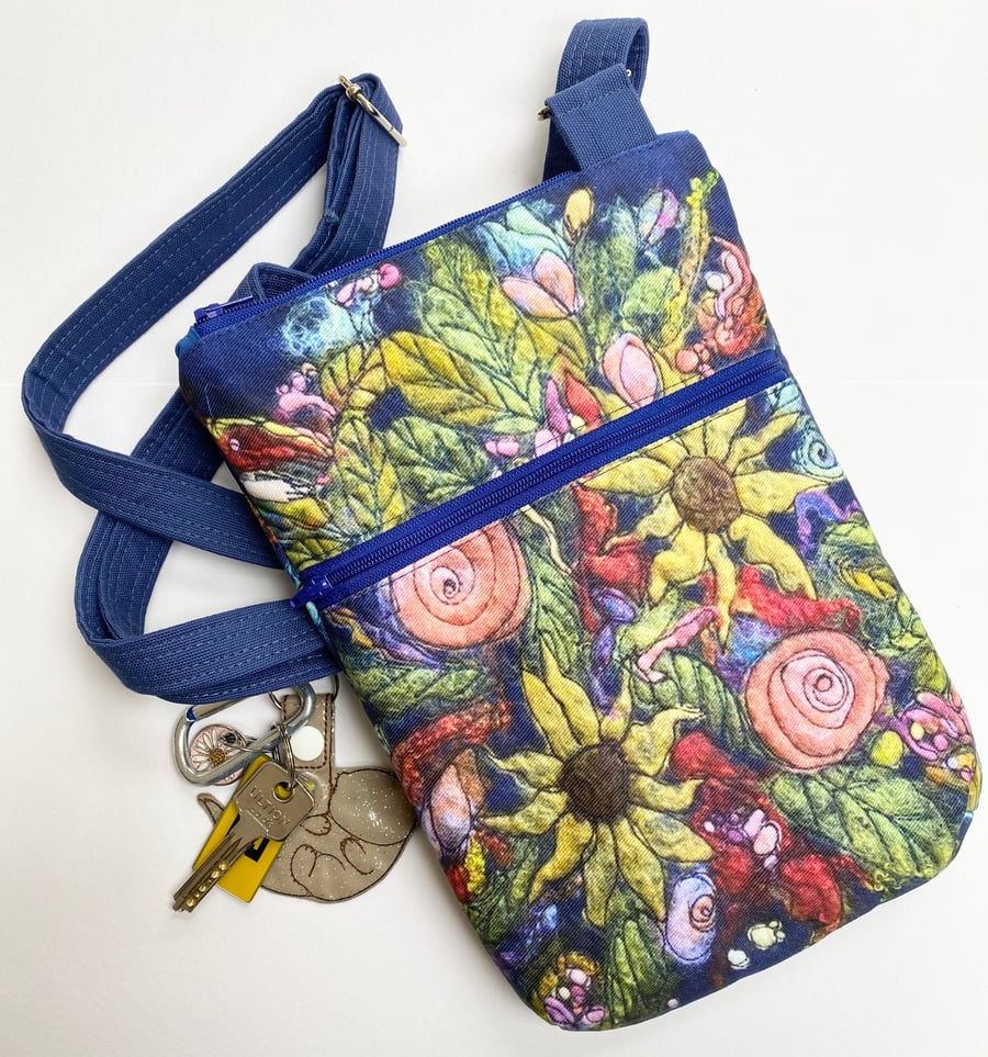 Flower cross body bag with adjustable strap. 