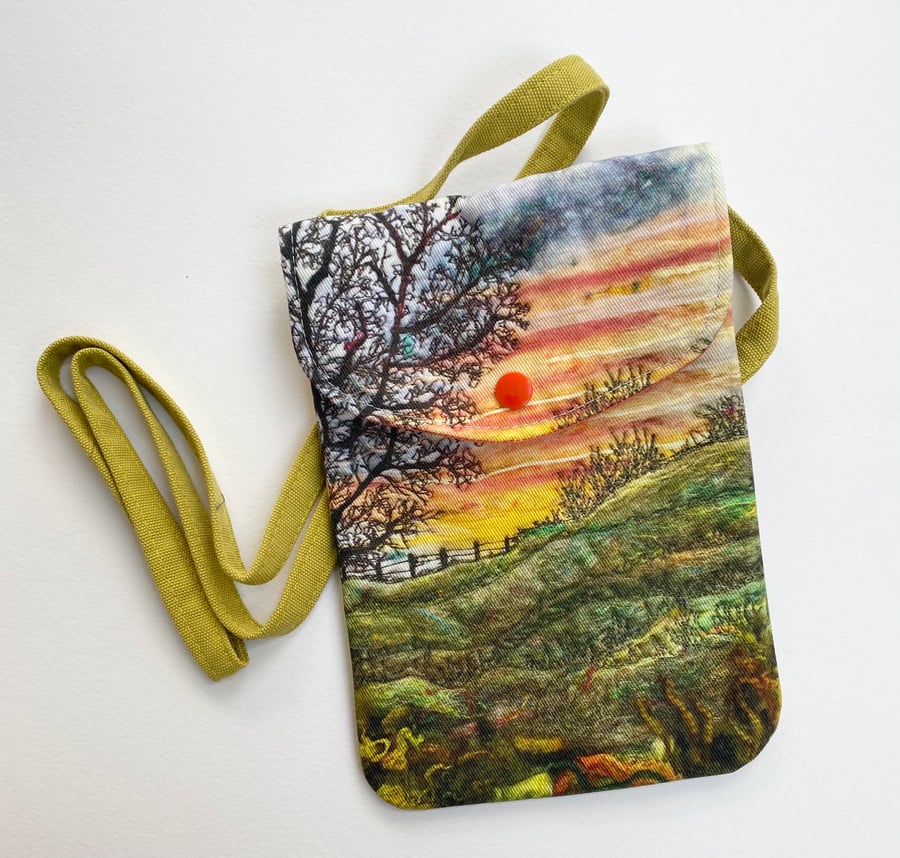 Sunrise tree and landscape cross body mobile phone bag with shoulder strap. 