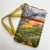 Sunrise sunset landscape cross body bag with adjustable strap. 