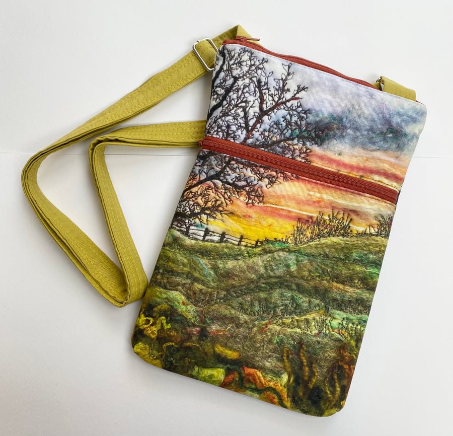 Sunrise sunset landscape cross body bag with adjustable strap. 