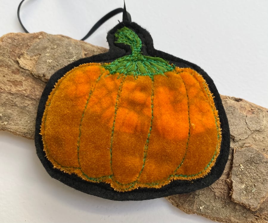 Embroidered up-cycled pumpkin home decoration.