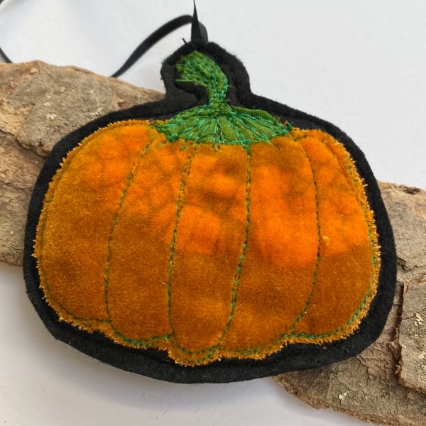 Embroidered up-cycled pumpkin home decoration.