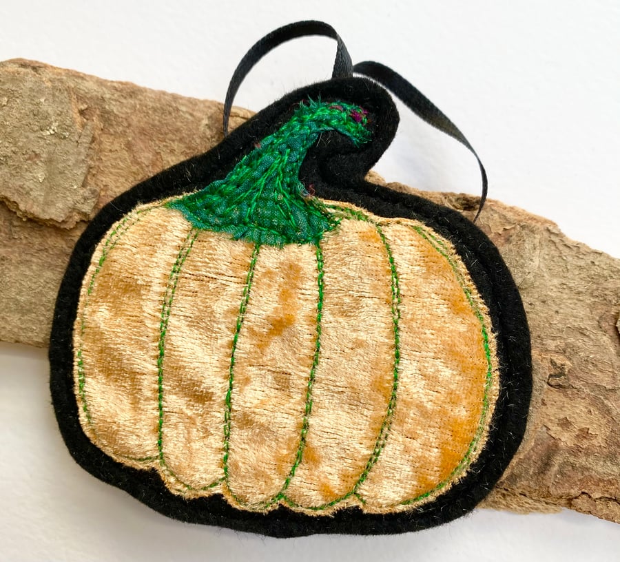 Embroidered up-cycled pumpkin home decoration.