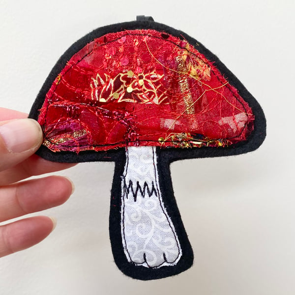 Embroidered up-cycled mushroom home decoration.