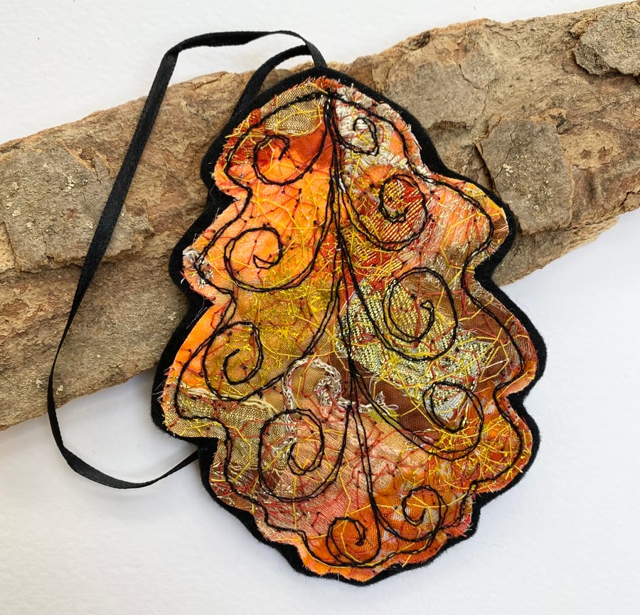 Embroidered up-cycled oak leaf home decoration.