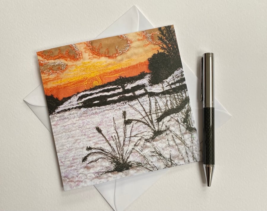 Embroidered sunset snow scene printed greetings card. 