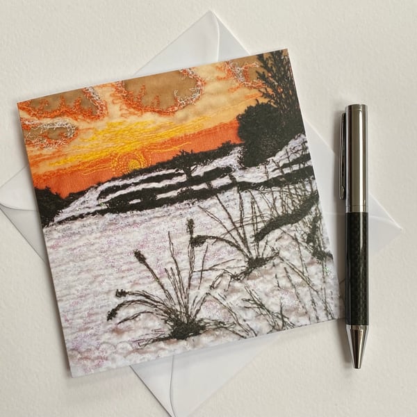 Embroidered sunset snow scene printed greetings card. 