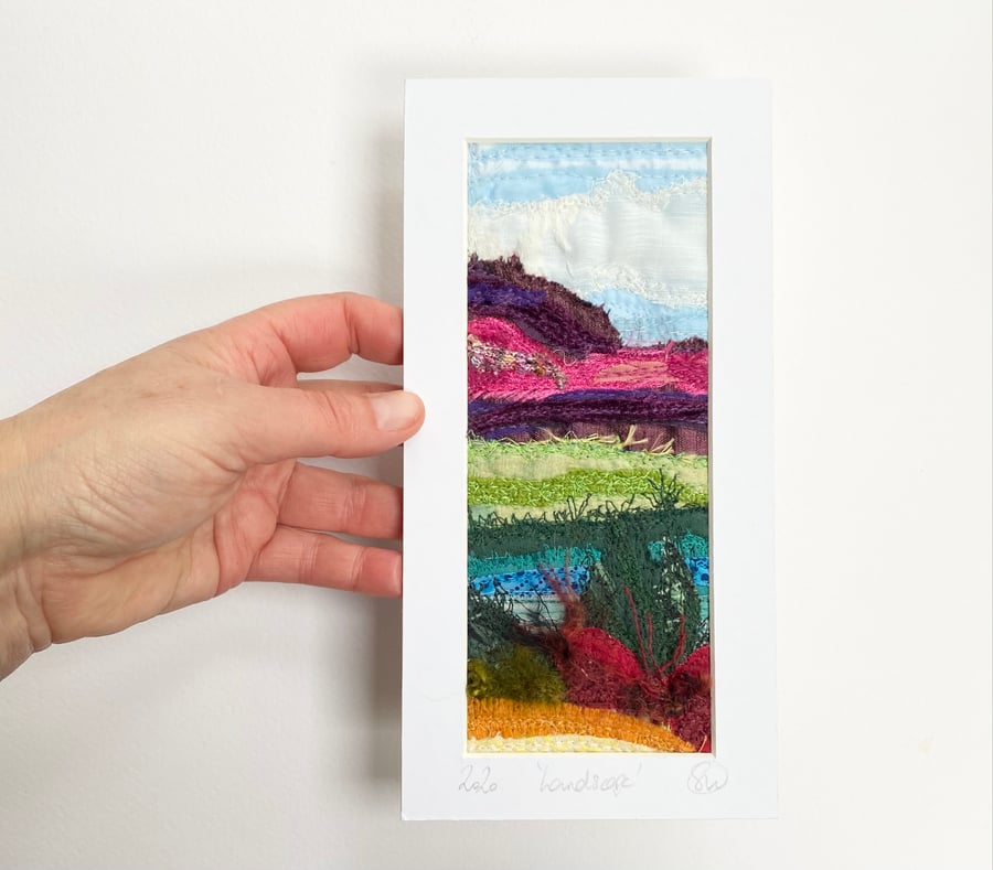 Upcycled and embroidered landscape wall art.