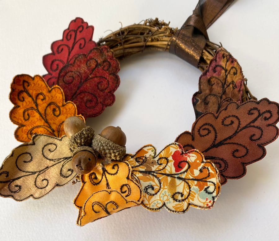 Up-cycled embroidered Autumnal leaves wreath with acorns. 
