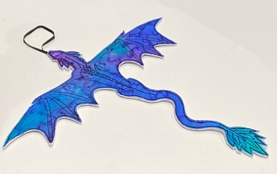 Embroidered up-cycled dragon home decoration.