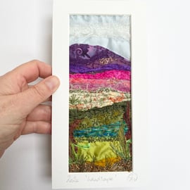 Upcycled and embroidered landscape wall art.