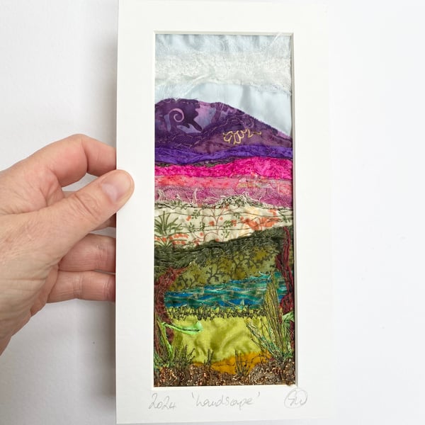 Upcycled and embroidered landscape wall art.