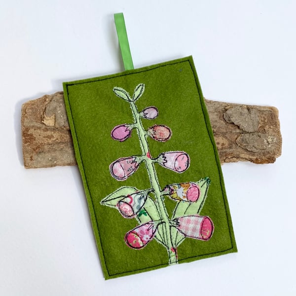 Embroidered up-cycled foxglove home decoration.