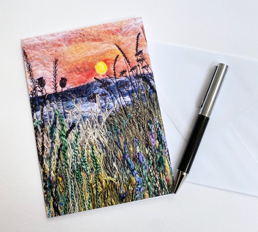 Sunrise on a misty morning across a hedgerow with the hills beyond printed card.