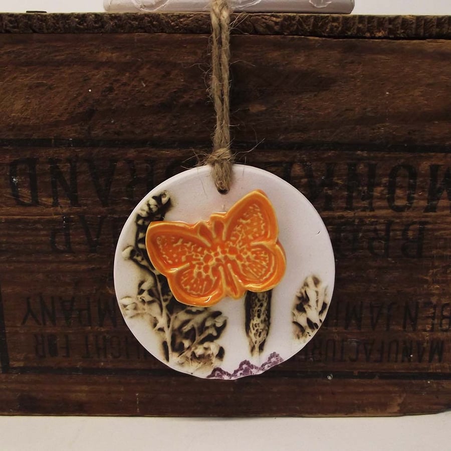 Pottery decoration with natural flower and butterfly motif.