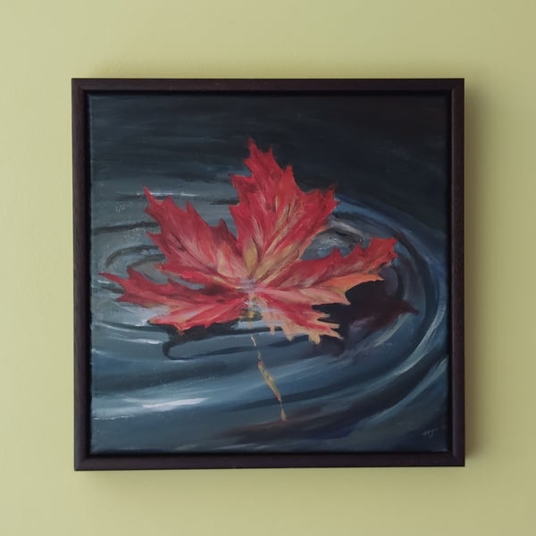 Gently Floating, Autumnal coloured leaf floating on water, origianal landscape