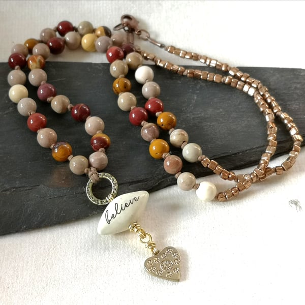 Jasper and mookite knotted necklace with believe pendant