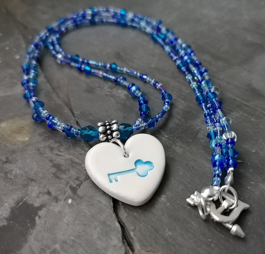 SALE blue ceramic heart pendant with key decoration and beaded necklace 