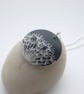 Black dandelion seed disc pendant necklace 