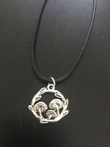 mushrooms in grass charm pendant on a 18" leather cord necklace
