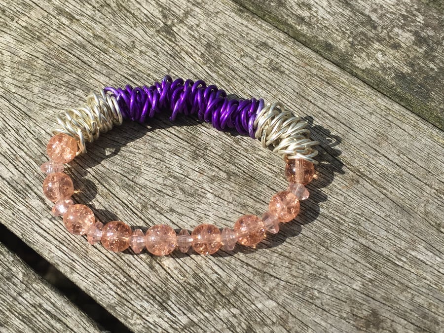 Peach beaded bracelet with silver and purple chain