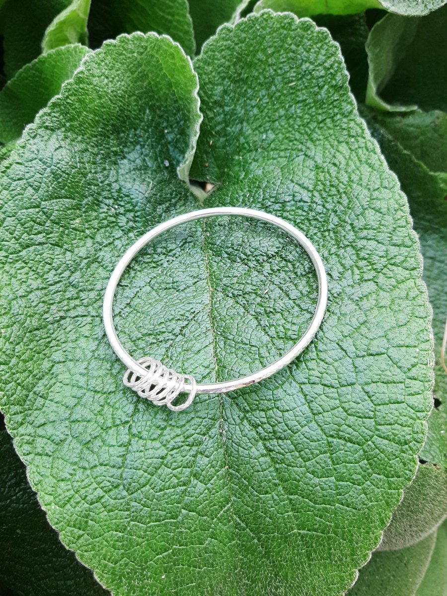 Heavy sterling silver hammered bangle with circles