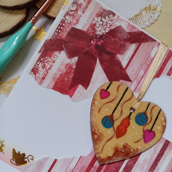 Christmas card with a wooden hanging baubles decoration