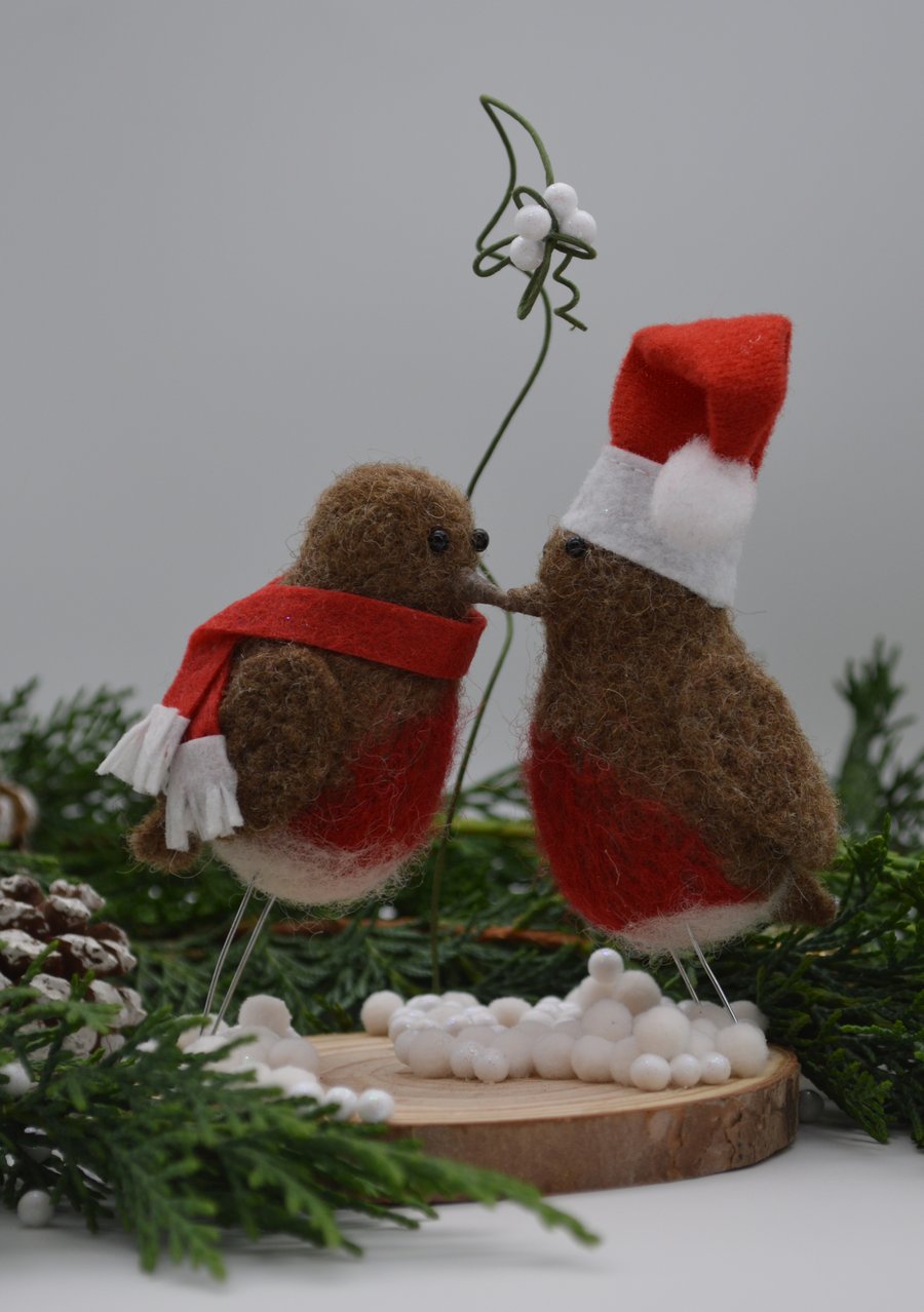 Christmas Robins kissing under mistletoe 