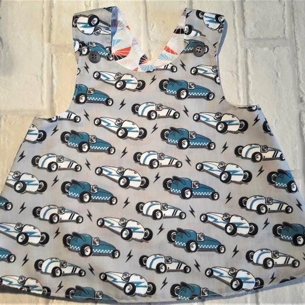 Reversible crossover pinafore dress with contemporary racing car design