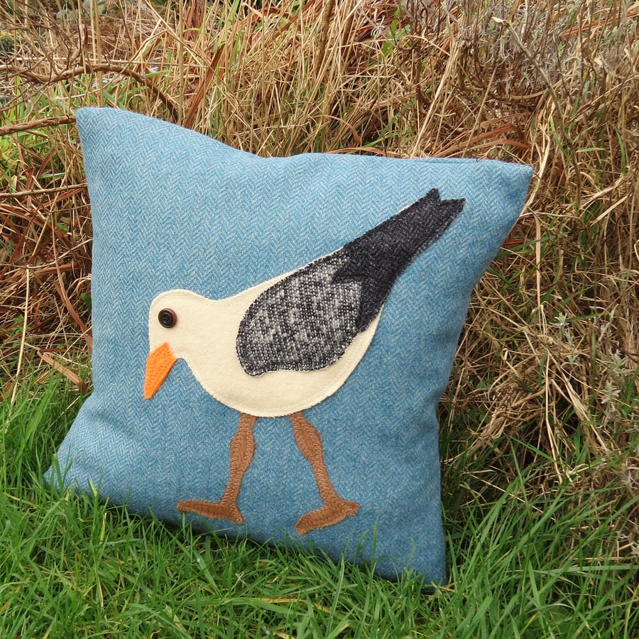 Wading gull.  A tactile cushion made from wool.  Complete with feather pad.