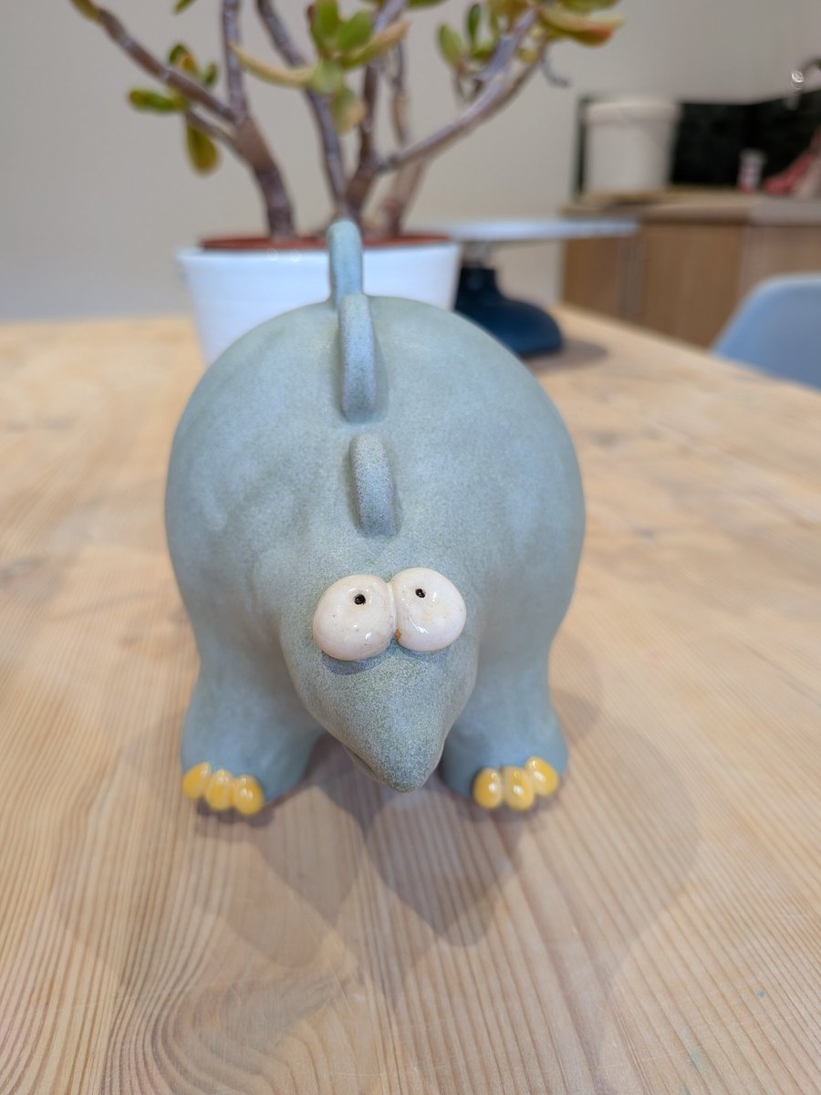 Ceramic stegosaurus ornament, dinosaur figurine 