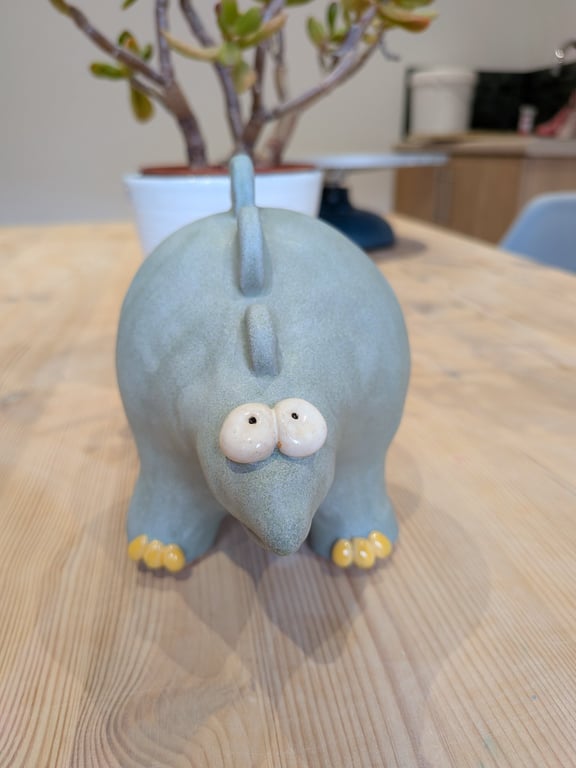 Ceramic stegosaurus ornament, dinosaur figurine 
