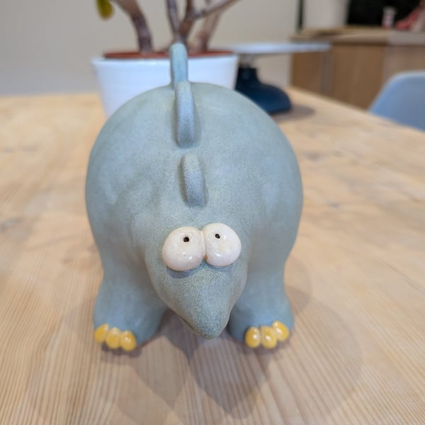 Ceramic stegosaurus ornament, dinosaur figurine 