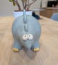 Ceramic stegosaurus ornament, dinosaur figurine 