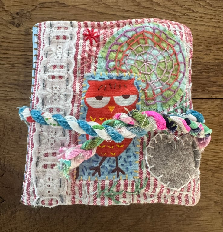 Needle case, with embroidery and repurposed fabric scraps. 