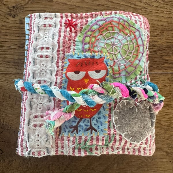 Needle case, with embroidery and repurposed fabric scraps. 