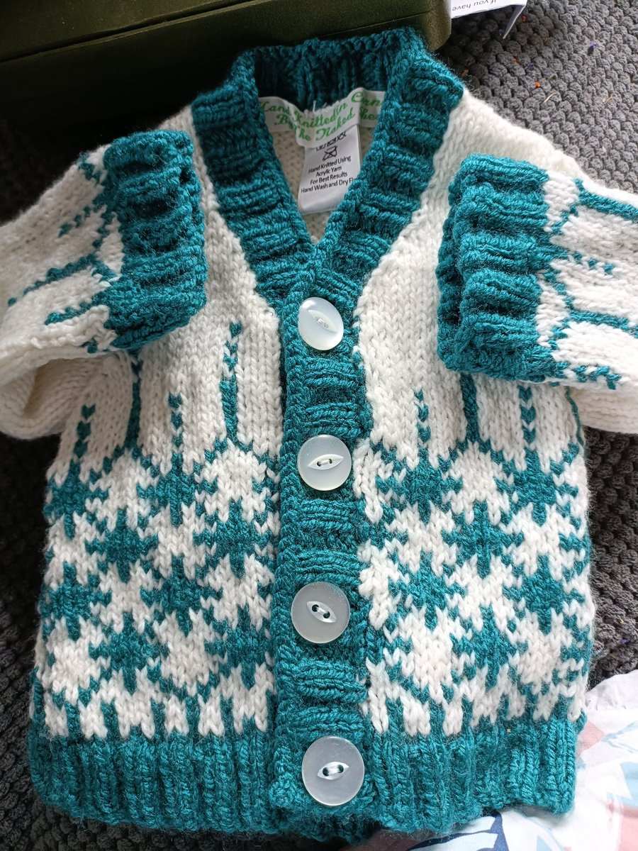Hand Knitted childrens cardigan in green and white 