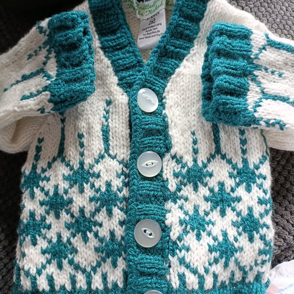 Hand Knitted childrens cardigan in green and white 